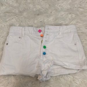 White Jean shorts with 5 buttons pink, orange, yellow green, and blue